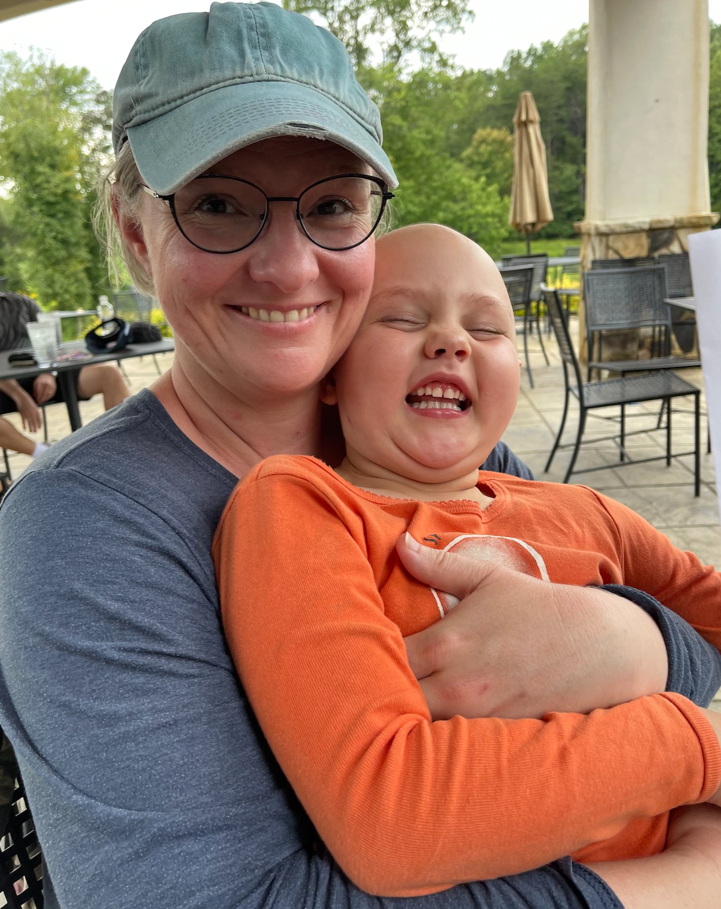 Barbra holding Eliza during chemotherapy, 2024